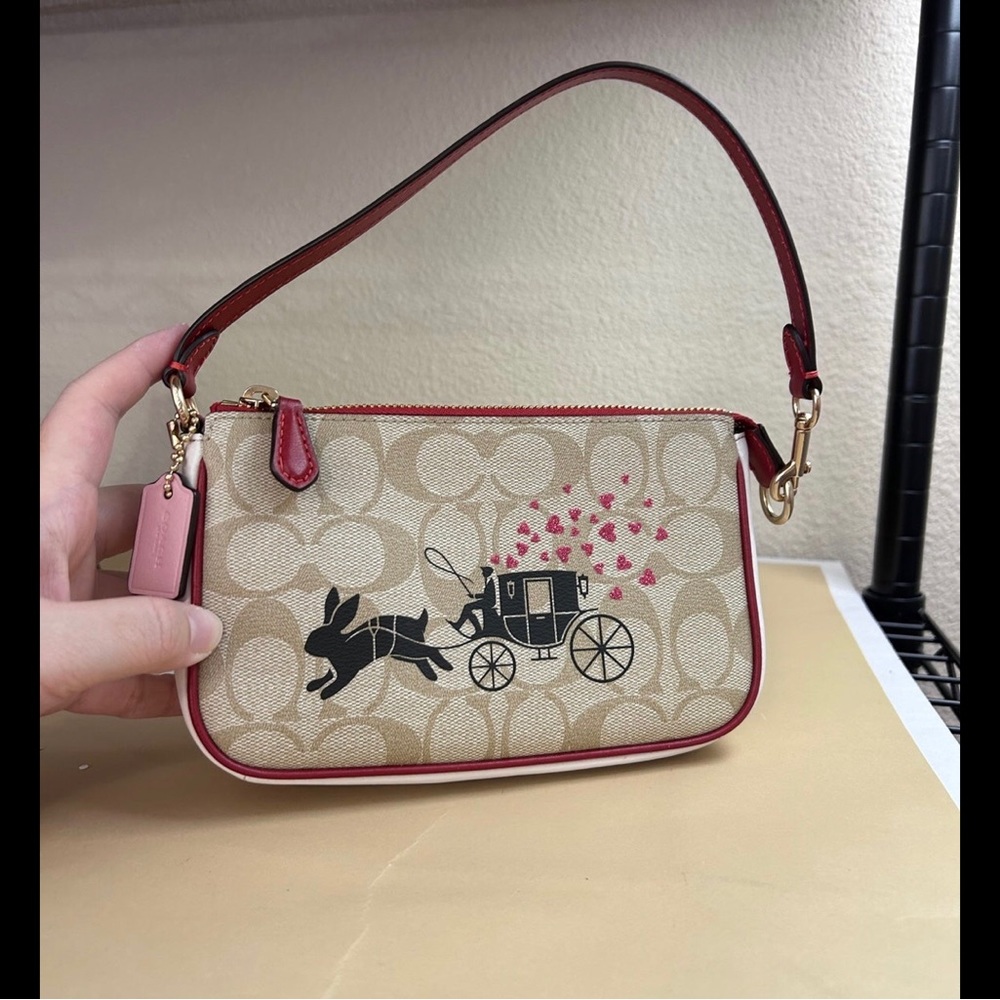 Coach Nolita 19 wristlet In Signature Canvas